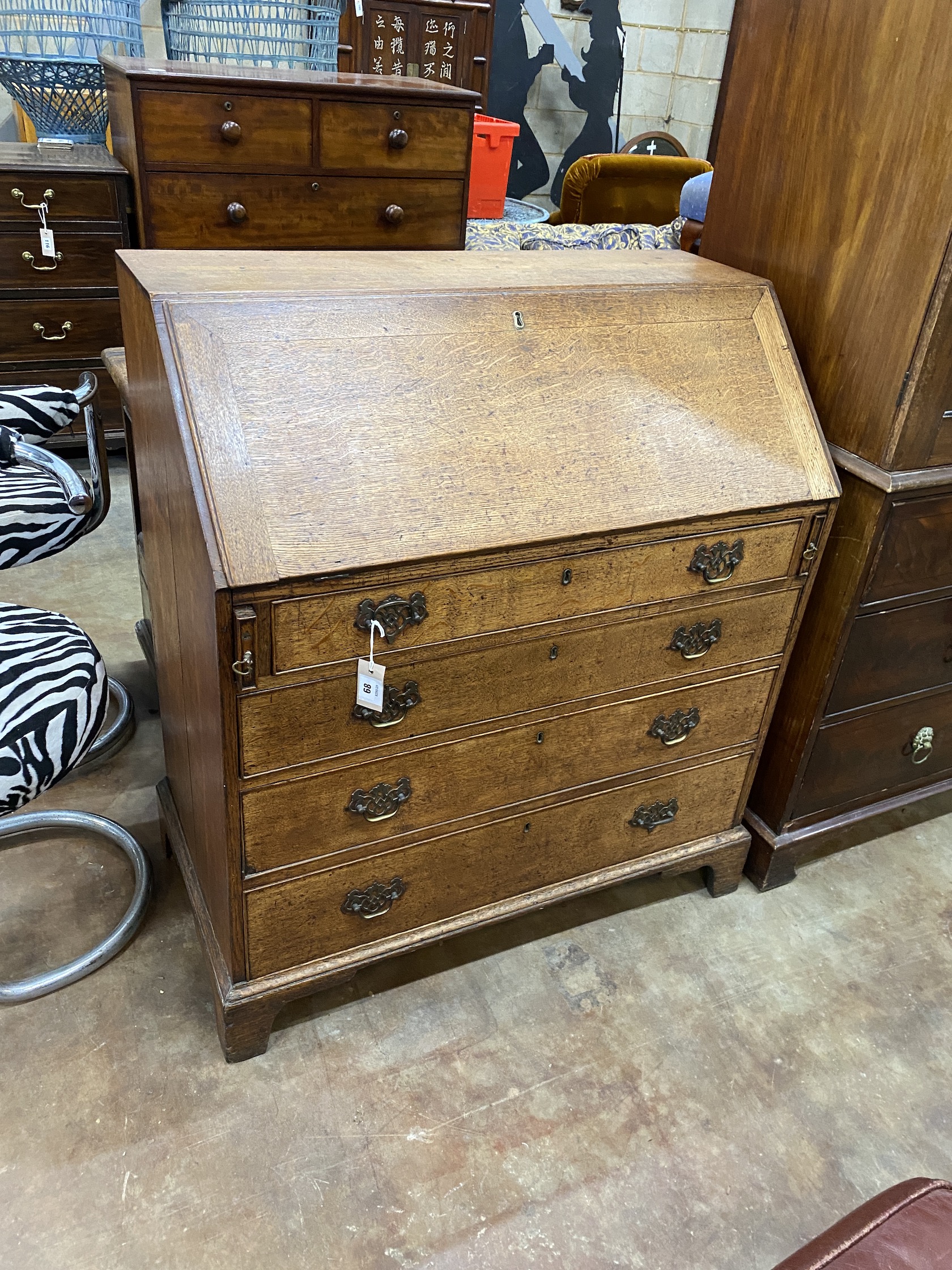 A George III oak bureau, width 92cm, depth 48cm, height 104cm